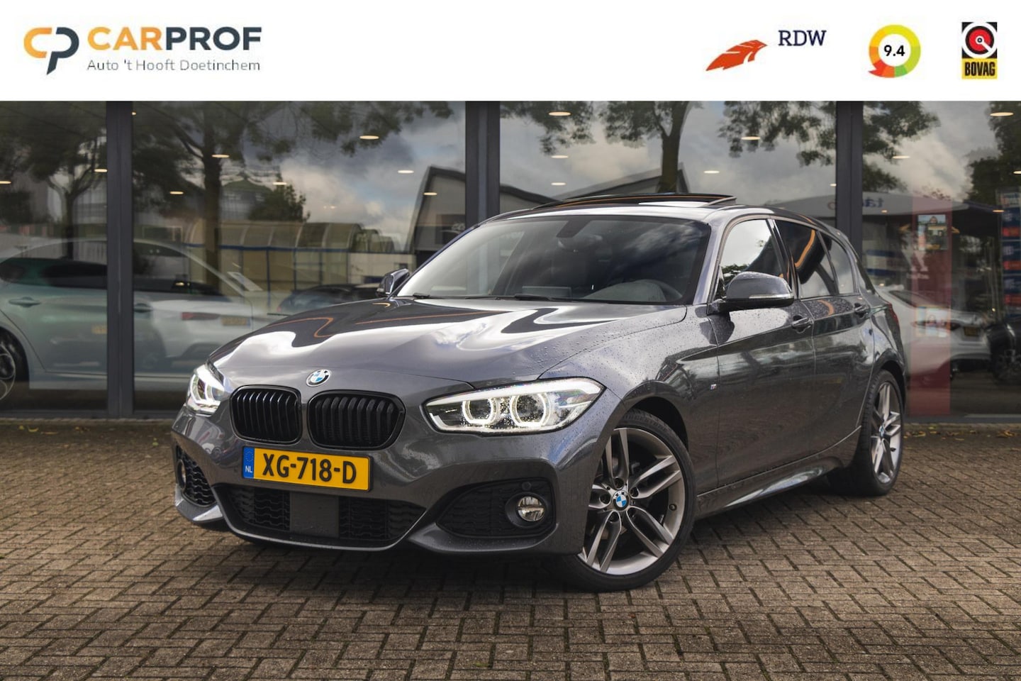 BMW 1-serie - 118i High Executive M Pakket | Panoramadak | Leder - AutoWereld.nl