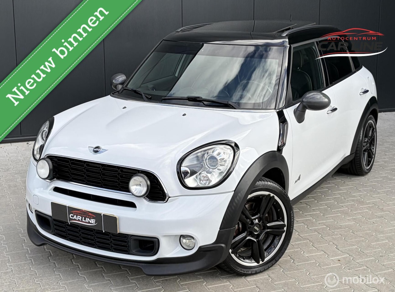 MINI Countryman - 1.6 Cooper S ALL4|XENON|PANO|CARBON|NAVI| - AutoWereld.nl