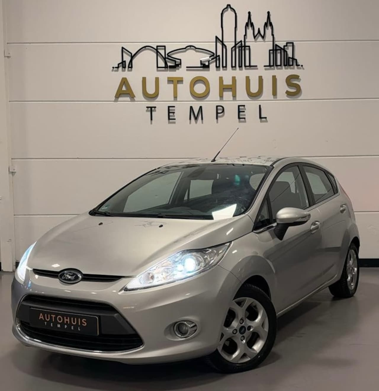 Ford Fiesta - 1.25 Titanium Nap Airco Cruise Climate Parkeersensoren 5Deurs - AutoWereld.nl