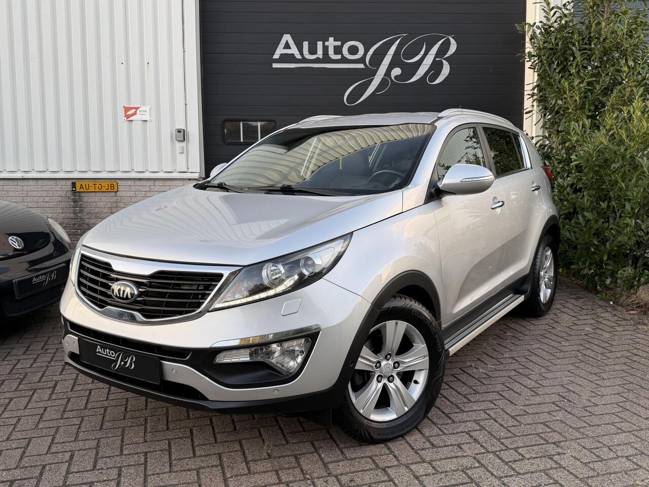 Kia Sportage - 2.0 SUPER PACK | AUTOMAAT | LEER | TREKHAAK - AutoWereld.nl