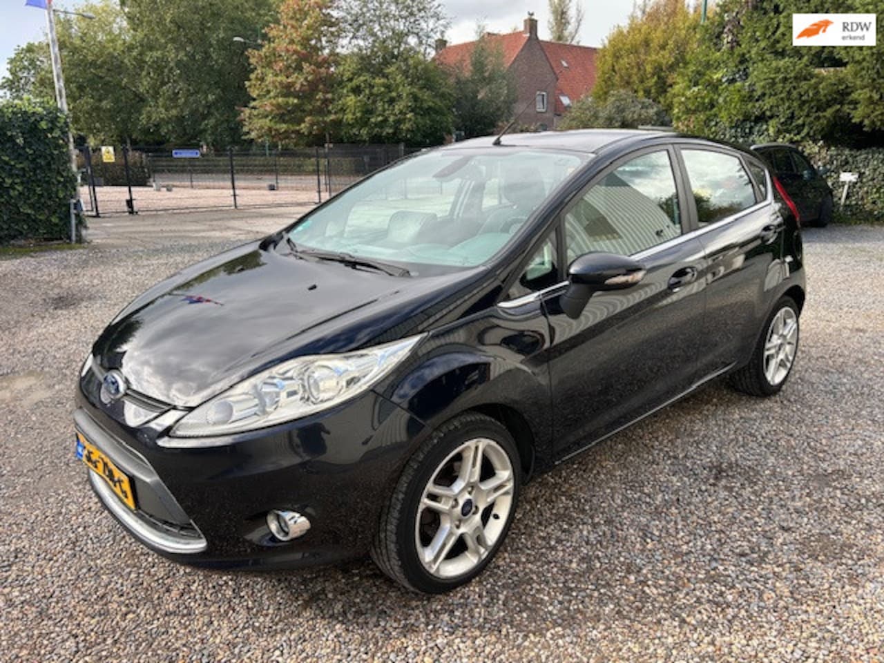 Ford Fiesta - 1.4 Ghia NAVI! STOEL-VRWRM - AutoWereld.nl