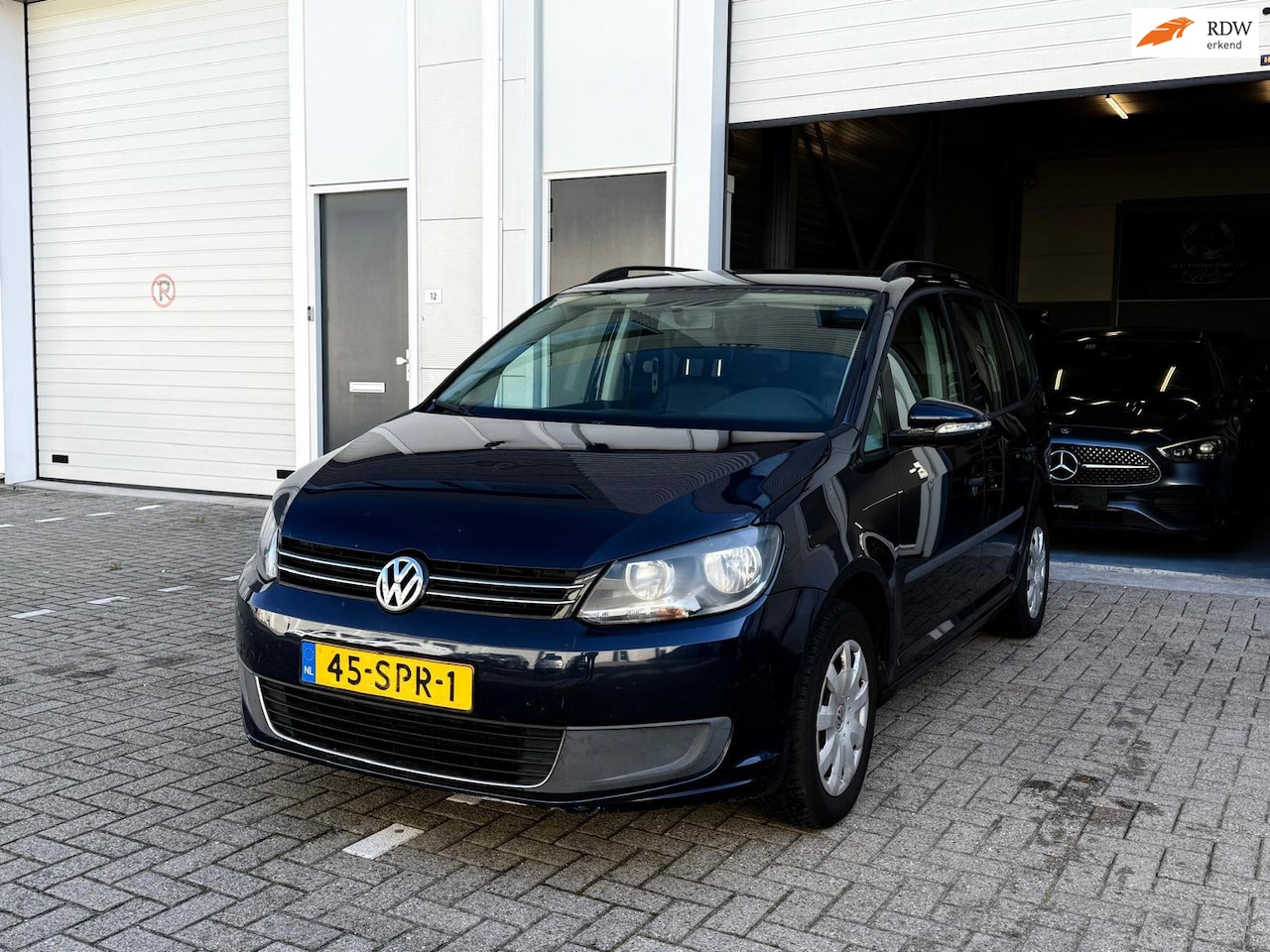 Volkswagen Touran - 1.2 TSI Highline BlueMotion - Pdc - Airco - Navi - Leder - AutoWereld.nl
