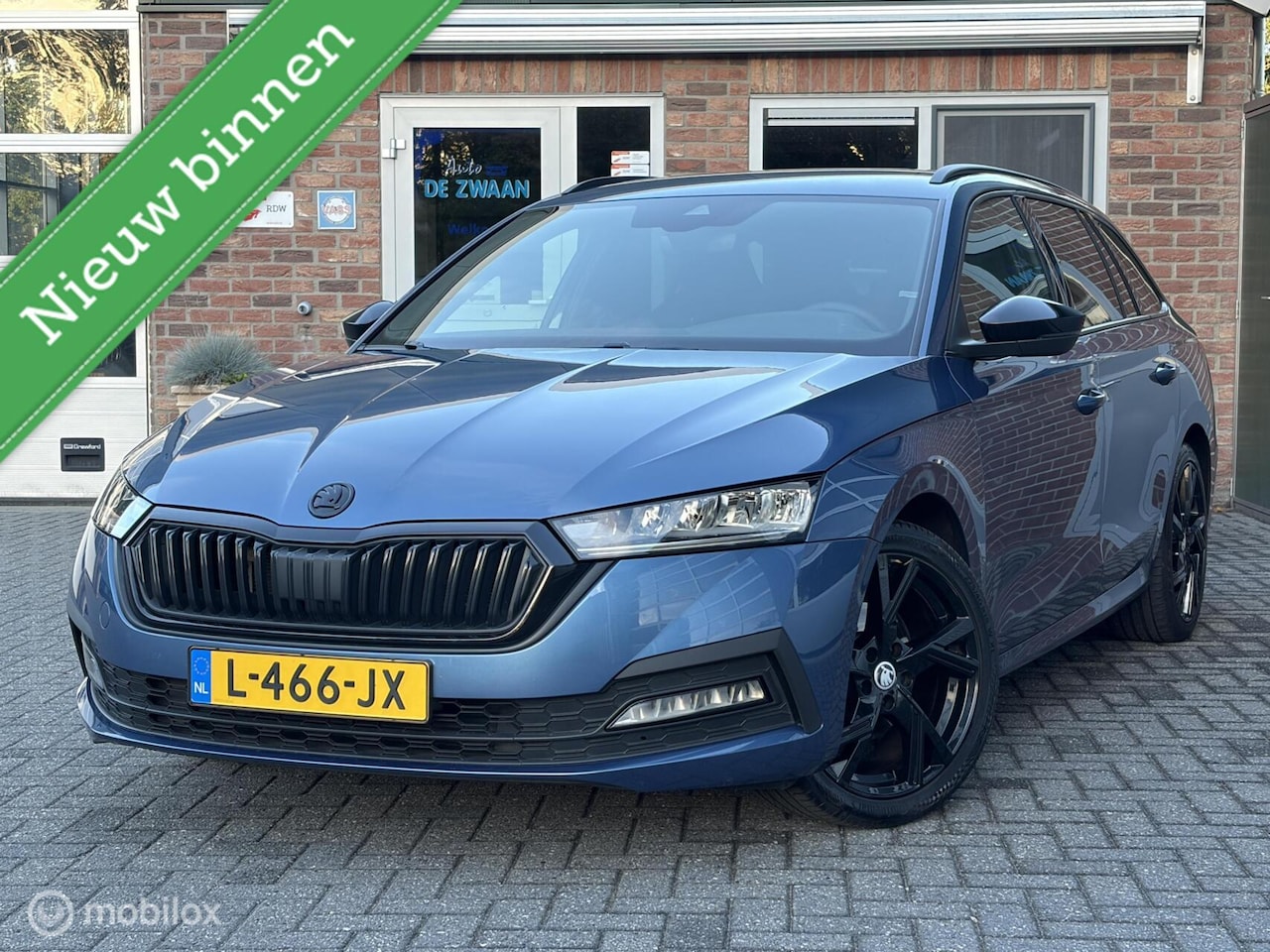 Skoda Octavia Combi - 1.0 TSI Sport Business|Wegklapbare Trekhaak|18 inch|Zwarte Hemel|Sportstoelen|Sfeerverlich - AutoWereld.nl