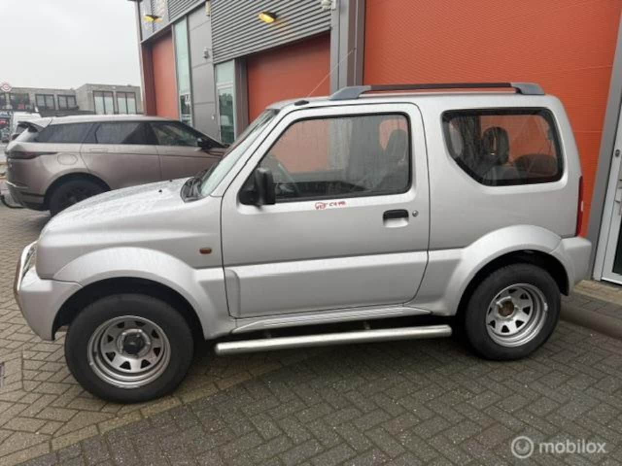 Suzuki Jimny - 1.3 JLX 4x4 103.006 KM NAP-APK 2027 - AutoWereld.nl