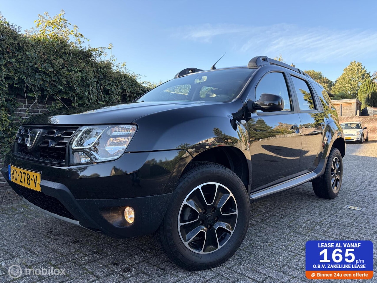 Dacia Duster - 1.2 TCe 4x2 Blackshadow / Leder / Navigatie - AutoWereld.nl