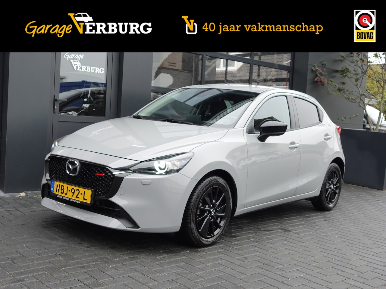 Mazda 2 - 1.5 e-SkyActiv-G 90 Homura (Navi/Carplay,Camera,Cruise,Stoel+stuurverwarming,PDC) -- 18.92 - AutoWereld.nl