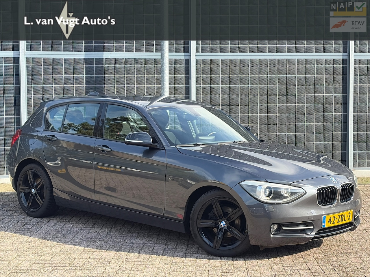 BMW 1-serie - 116i Sport Business | incl 12 mnd Garantie - AutoWereld.nl