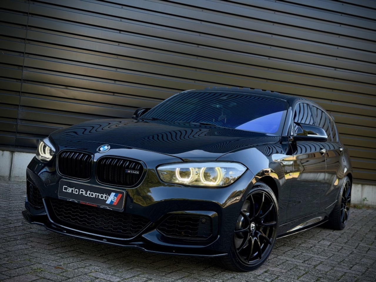 BMW 1-serie - M140i xDrive DAK|H/K|MEMORY|MILLTEK|CAMERA VOL! - AutoWereld.nl