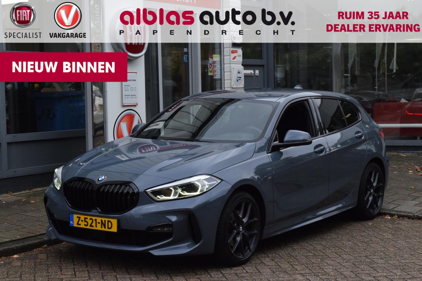 BMW 1-serie - 118i|M-Sport|M-stoelen|Elek.klep|18"|Sfeer|Carplay - AutoWereld.nl