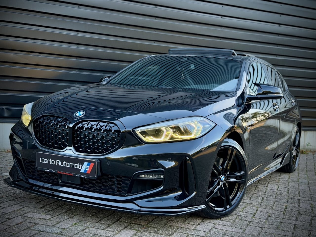 BMW 1-serie - 118i High M-PERF. M135 PANO|SCHAALSTOEL|HUD|ACC|HiFi - AutoWereld.nl