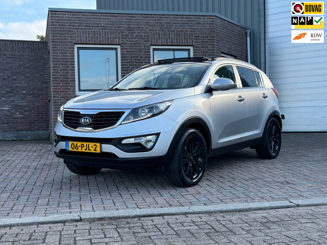 Kia Sportage - 2.0 X-ecutive Plus Pack | Pano | 1/2 Leder | Climate | PDC | Cruise | Trekhaak | Recent gr - AutoWereld.nl