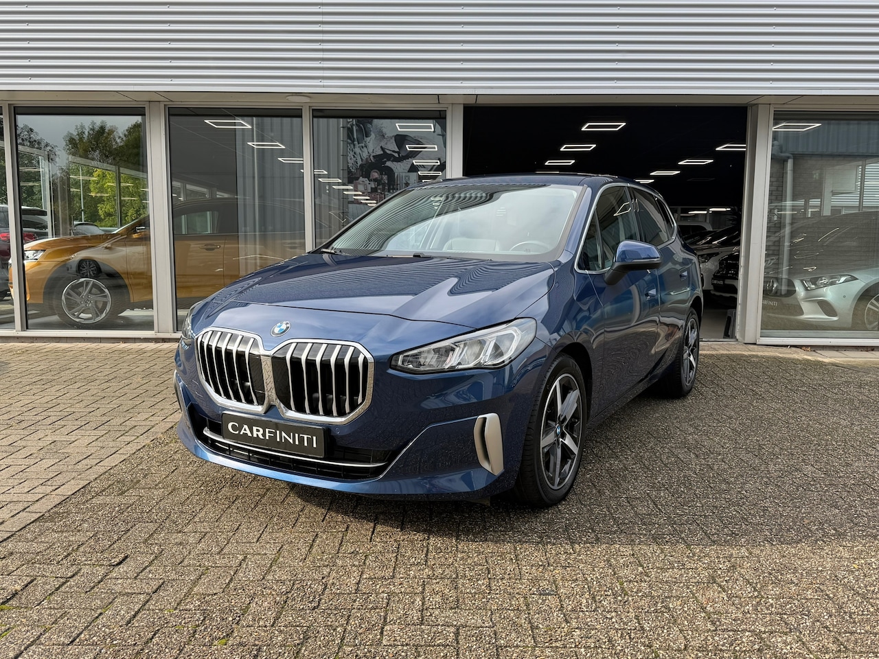 BMW 2-serie Active Tourer - 220i M-Sport Automaat 170 Pk | Navi | Voll Leder | Clima | Cruise | Camera | Sfeerverlicht - AutoWereld.nl