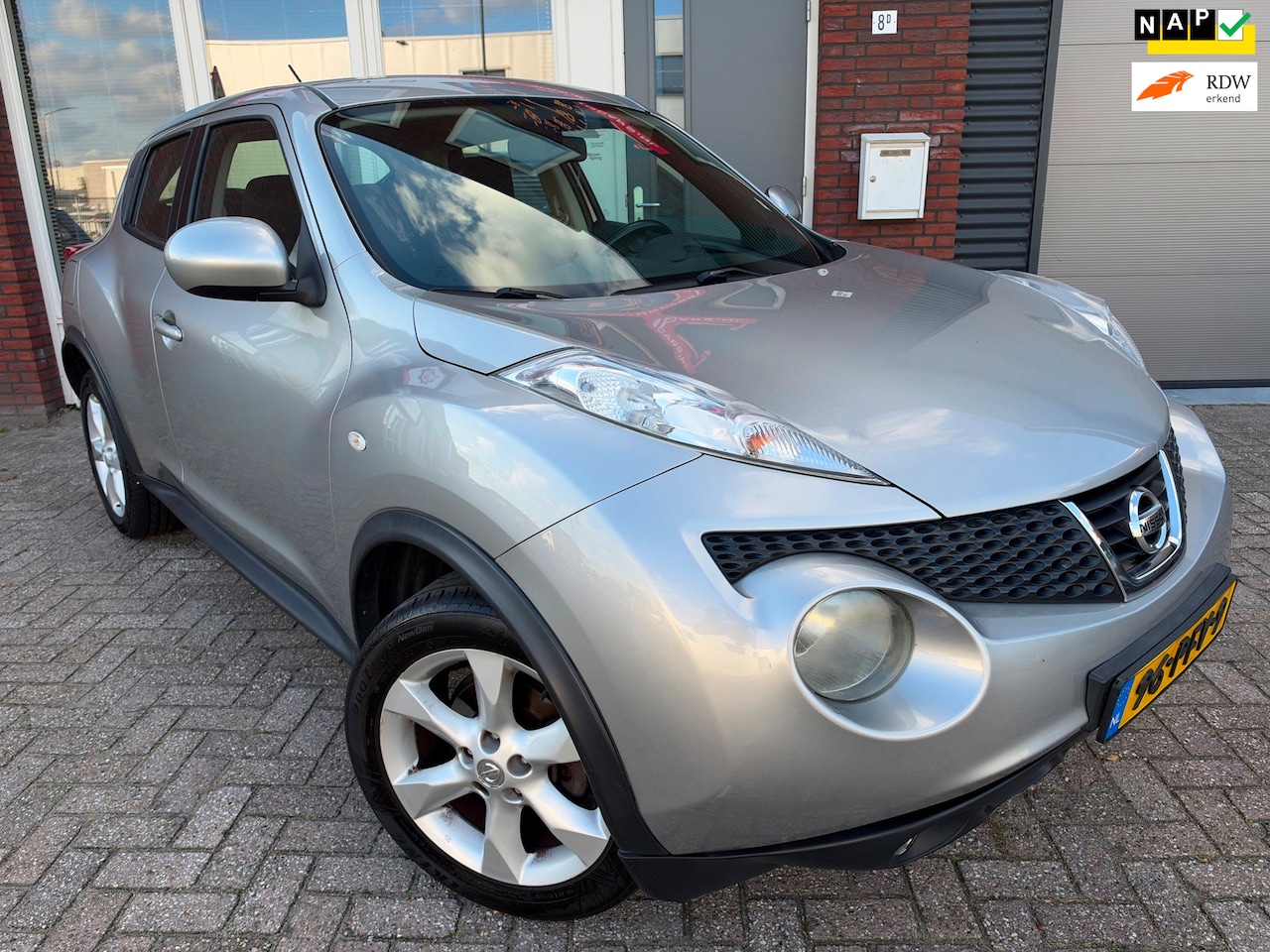 Nissan Juke - 1.6 Acenta / PDC / AUT / Clima / Cruise / LM / NAP - AutoWereld.nl