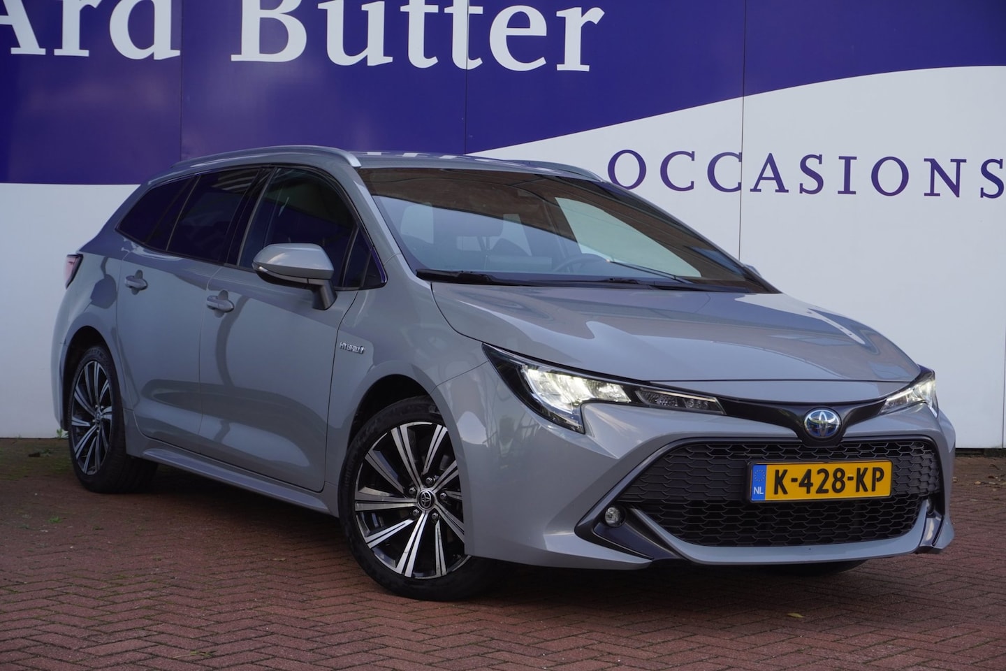 Toyota Corolla Touring Sports - 1.8 Hybrid Dynamic+Led+Half-leder+Stoel-verw+Apple-carplay+trekhaak+Vitrual+camera = NARDO - AutoWereld.nl