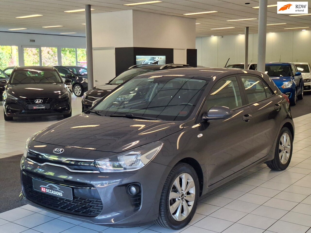 Kia Rio - 1.2(4 cil) Bluetooth/PDC/Cruise/Stoel+Stuuverw - AutoWereld.nl
