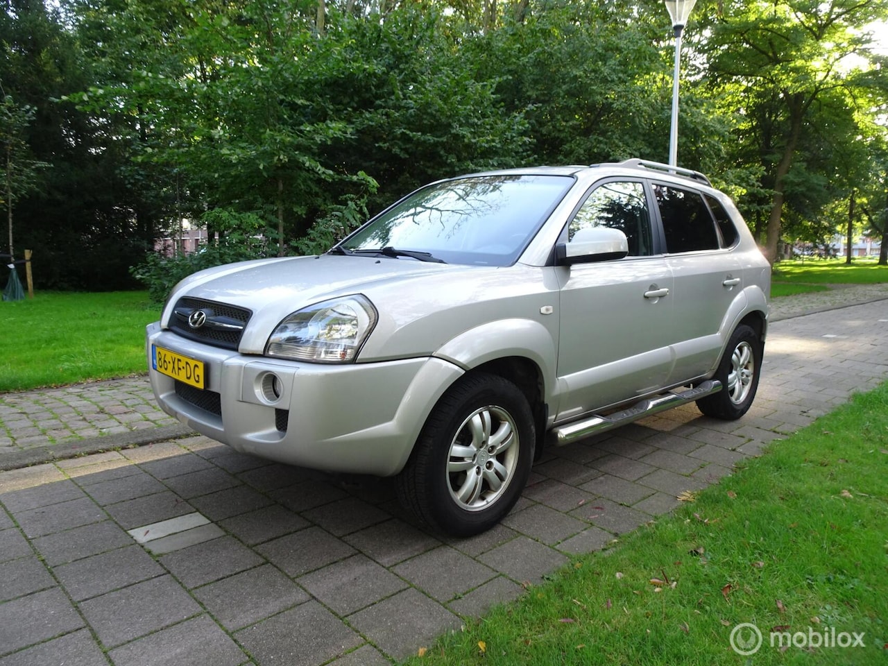 Hyundai Tucson - 2.0i Dynamic|AIRCO|LEDER|STOELVER.|DEALER OND. - AutoWereld.nl