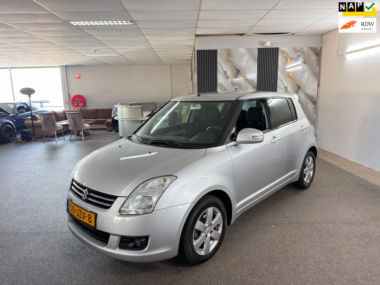 Suzuki Swift - 1.3 Limited Apk Nieuw,Airco,Stoelverwarming,Carplay,E-Ramen+Spiegels,N.A.P,Lm velgen,Topst - AutoWereld.nl