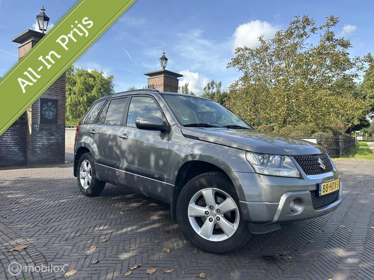 Suzuki Grand Vitara - 2.4 Exclusive 4x4 Trekhaak Cruise✅ - AutoWereld.nl