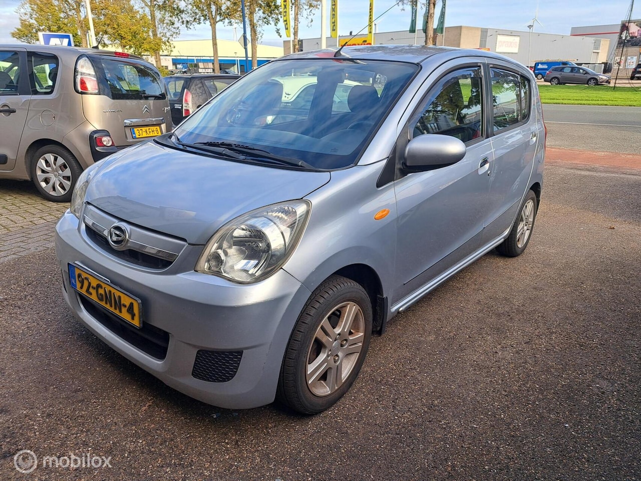 Daihatsu Cuore - 1.0 Premium airco cruise sportvelgen - AutoWereld.nl