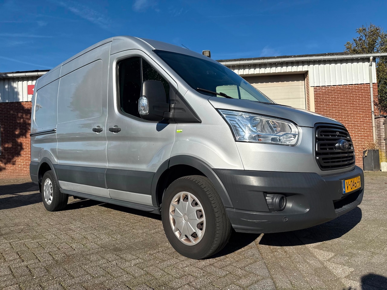 Ford Transit - 350 2.0 TDCI L2H2 Trend sortimo inrichting euro 6 airco cruise camera navi - AutoWereld.nl