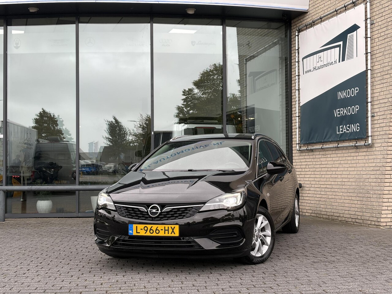Opel Astra Sports Tourer - 1.2*NAVI*ECC*CAM*CRUISE*HAAK*TEL*LED* - AutoWereld.nl