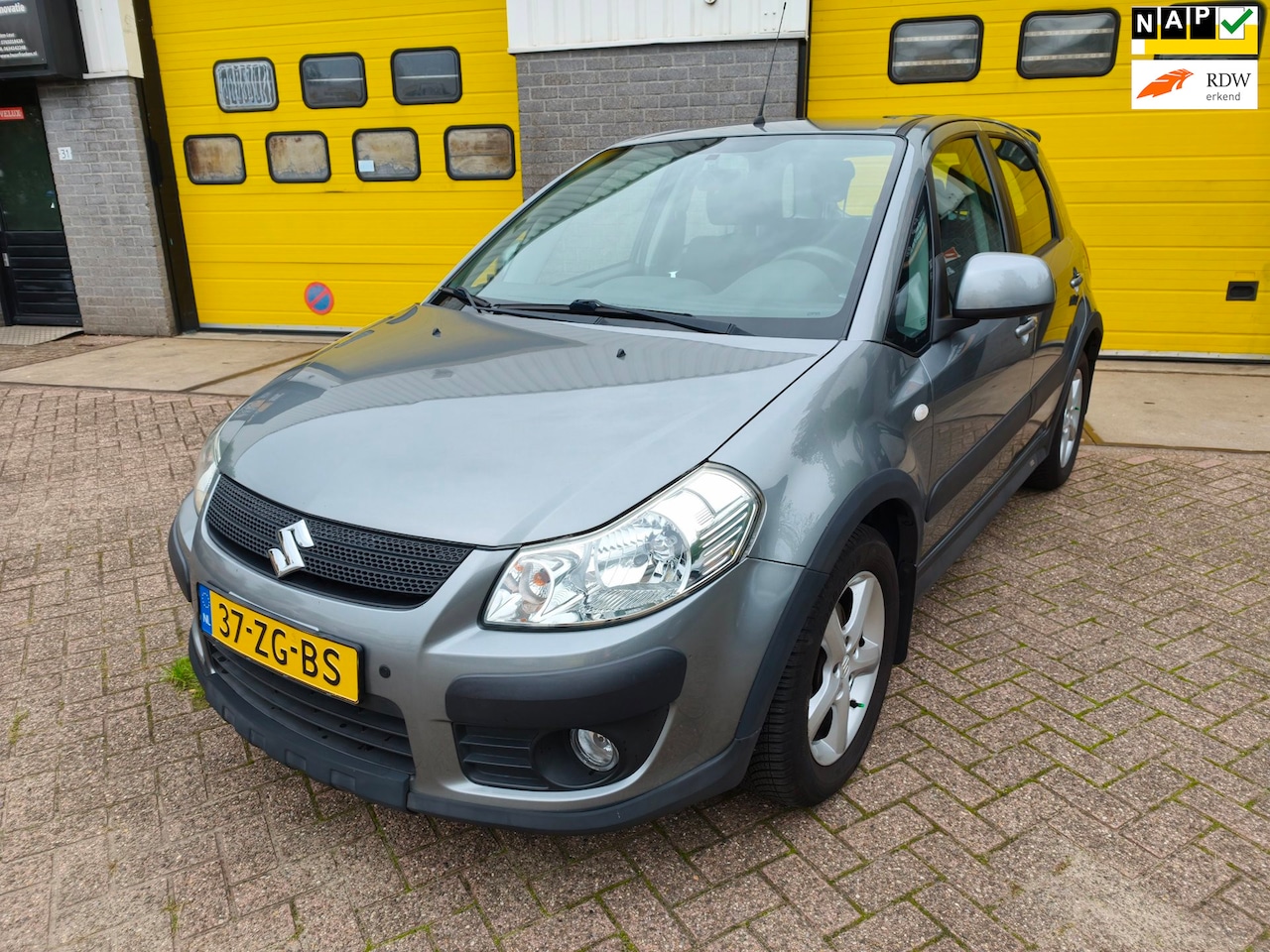 Suzuki SX4 - 1.6 Exclusive 1.6 Exclusive, LAGE KM-STAND, NAP, AIRCO, TREKHAAK - AutoWereld.nl