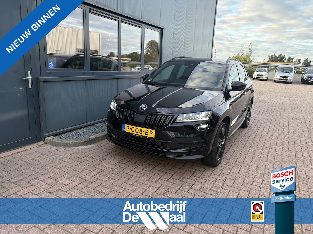 Skoda Karoq - 1.5 TSi ACT DSG Sportline Business CAMERA/KEYLESS/VIRTUAL/TREKHAAK/WINTERPACK - AutoWereld.nl