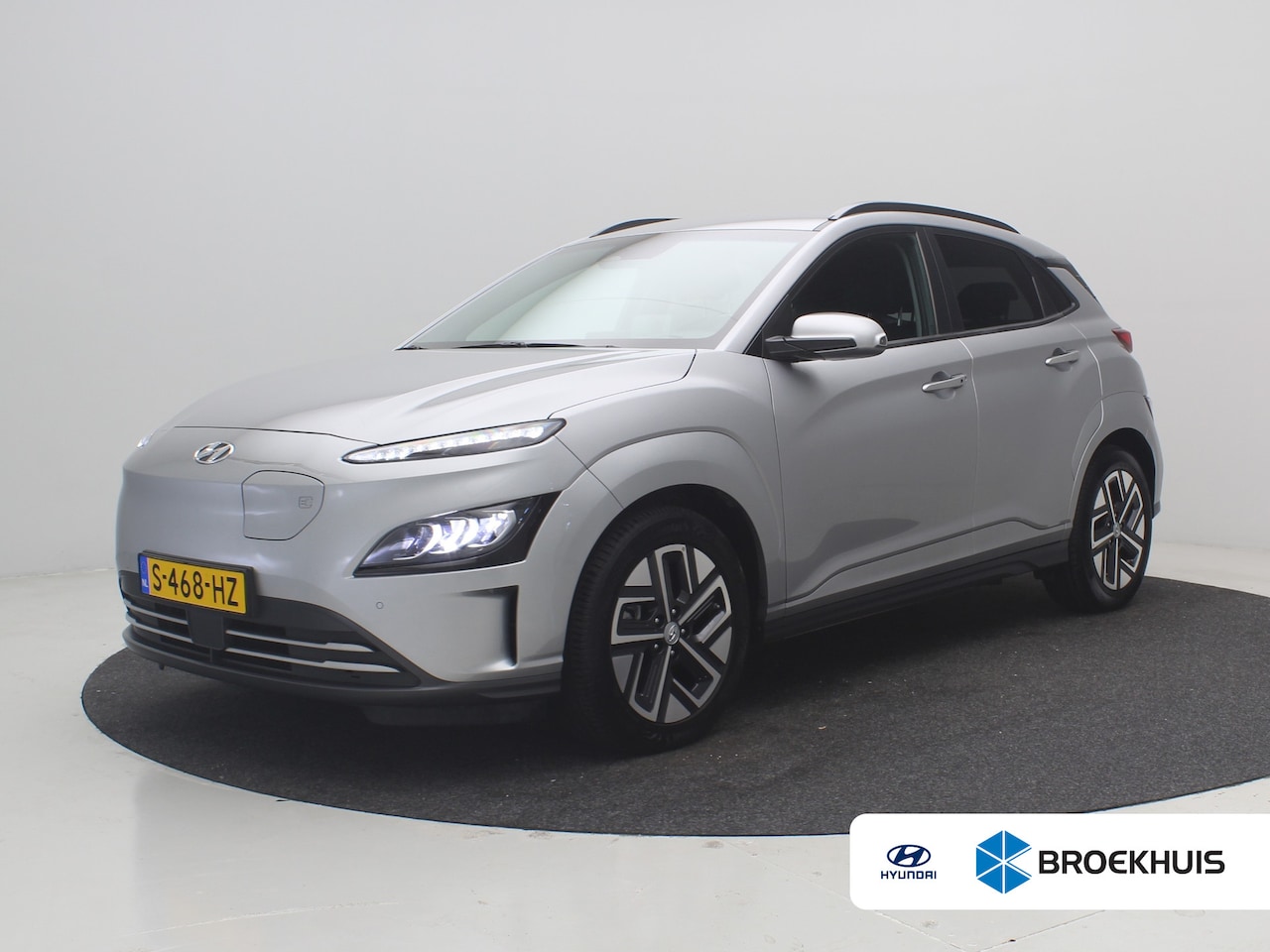 Hyundai Kona Electric - EV Premium 64 kWh SOH 100% / 1ste eigenaar | Achterbank verwarmd | Achteruitrijcamera | Ap - AutoWereld.nl