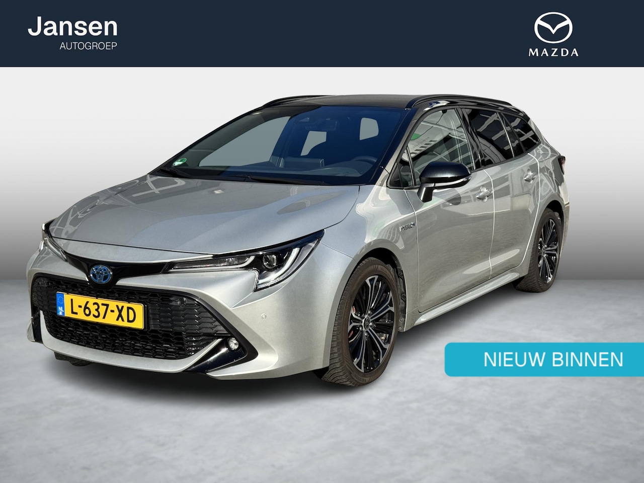 Toyota Corolla Touring Sports - 1.8 Hybrid Dynamic two-tone, trekhaak, all weather banden, achteruitrijcamera, navigatie, - AutoWereld.nl