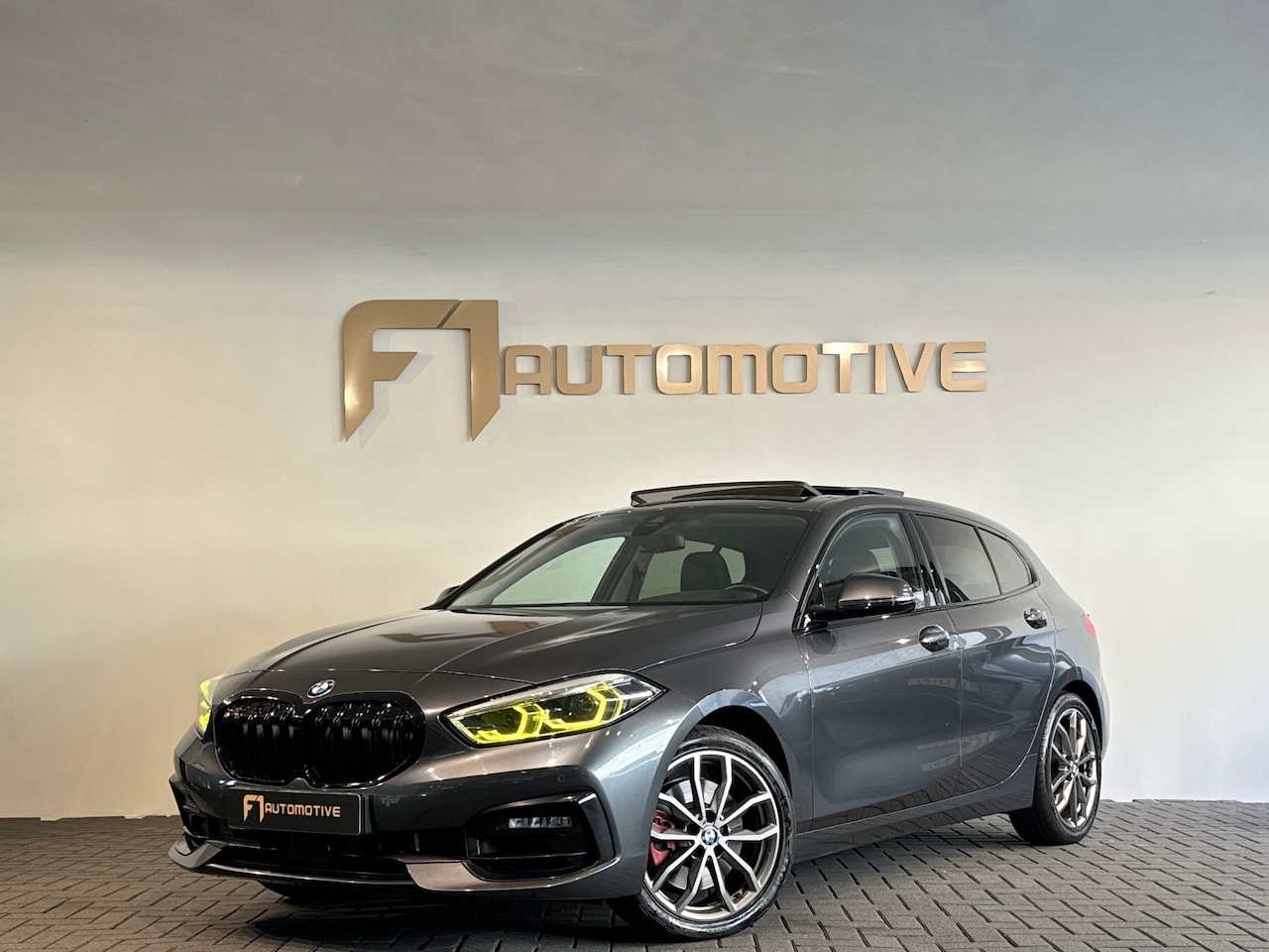 BMW 1-serie - 120i High Executive Pano|Stoelverwarming|Cruise Control - AutoWereld.nl