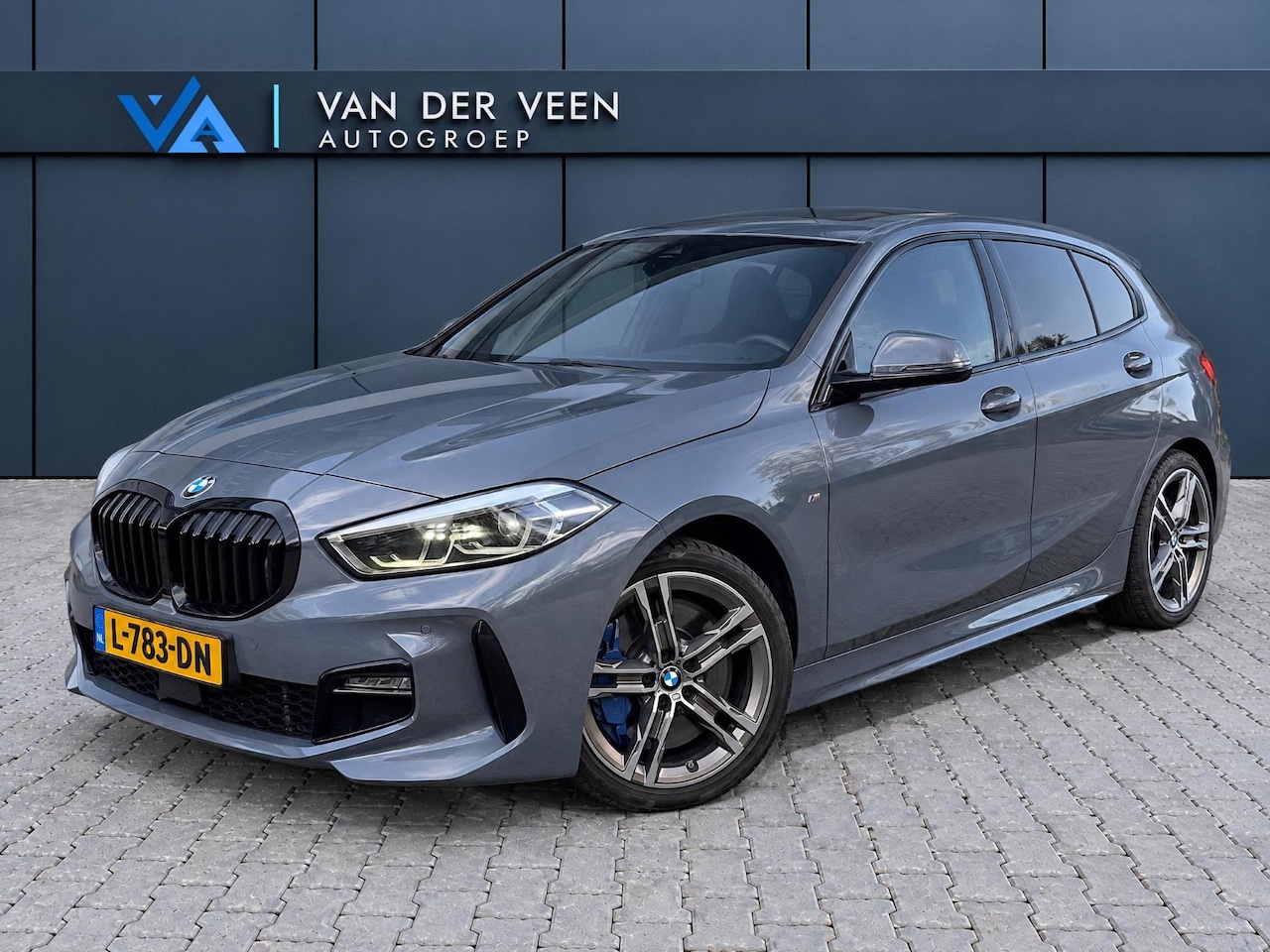 BMW 1-serie - 118i High Executive M-sport | Incl. 12 maanden garantie | Cruise control | Kuipstoelen | S - AutoWereld.nl