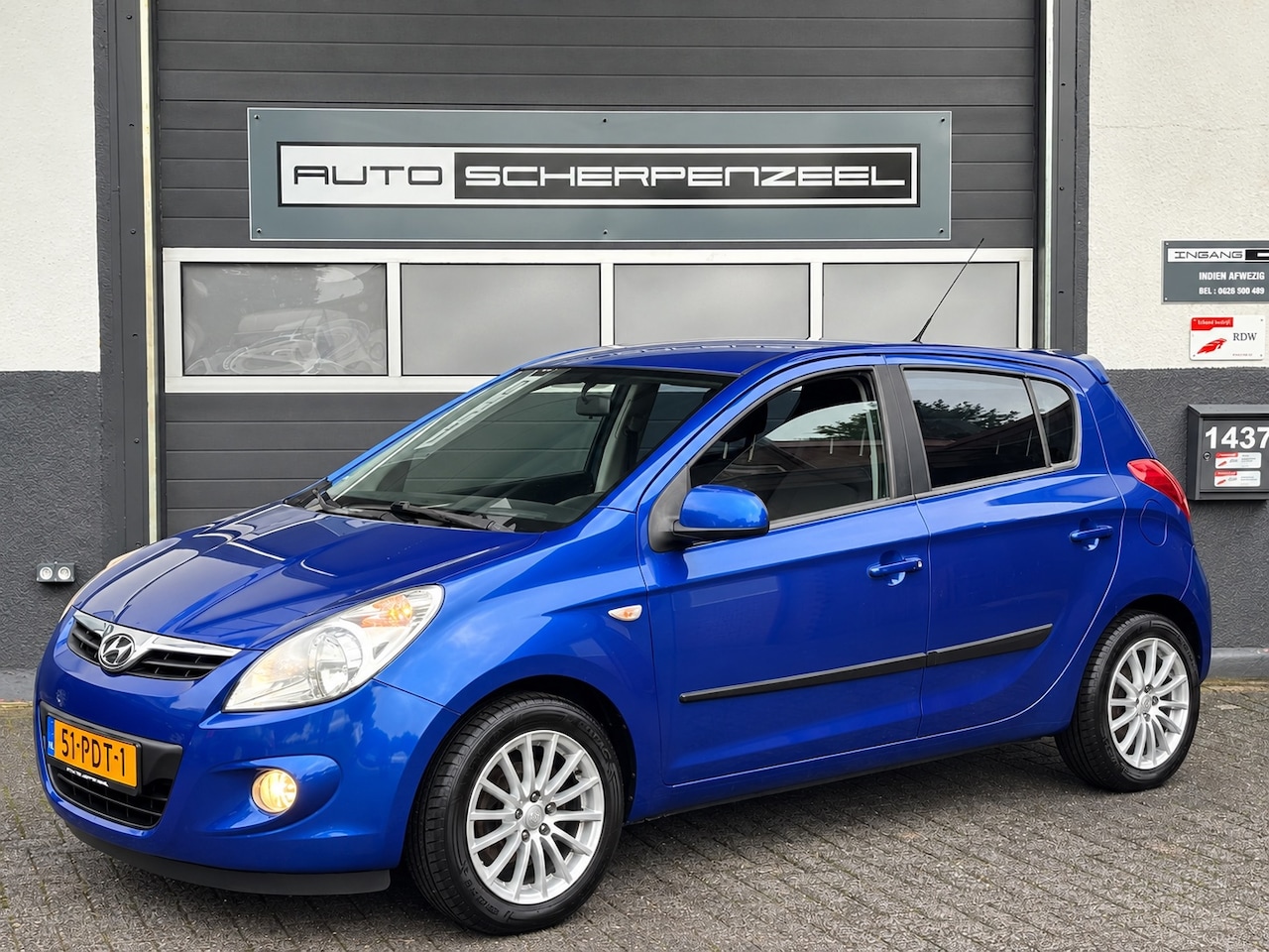Hyundai i20 - 1.4i Dynamic | AIRCO | 106 dkm | ZUINIG | NL AUTO - AutoWereld.nl