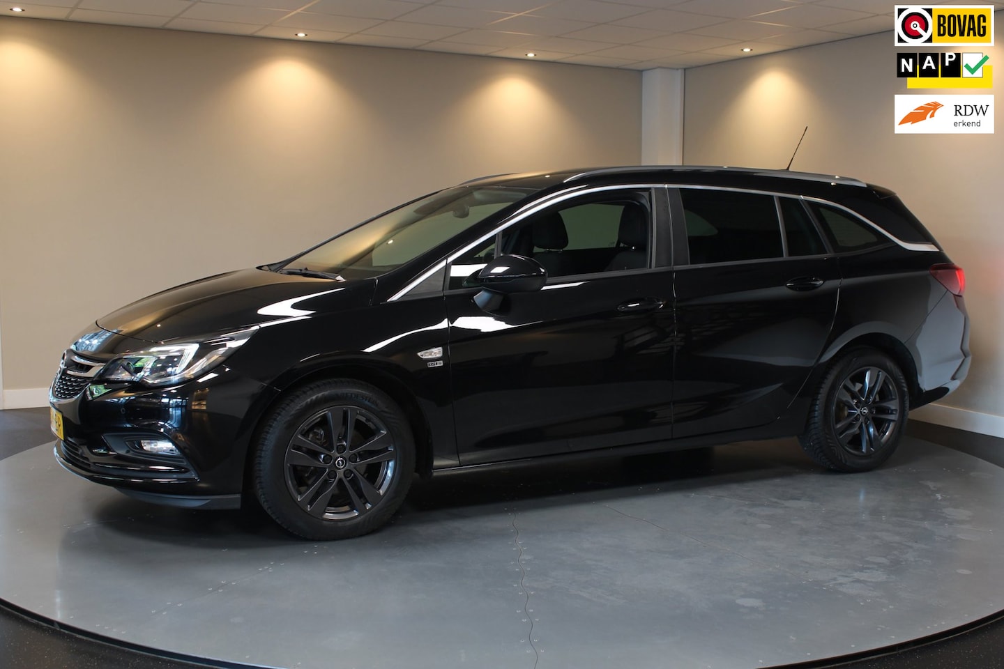 Opel Astra Sports Tourer - 1.0 Turbo 120 Jaar Edition *Carplay* Cruise|Lane-Assist|Navi|PDC|All-seasons|DAB|BT|Climat - AutoWereld.nl