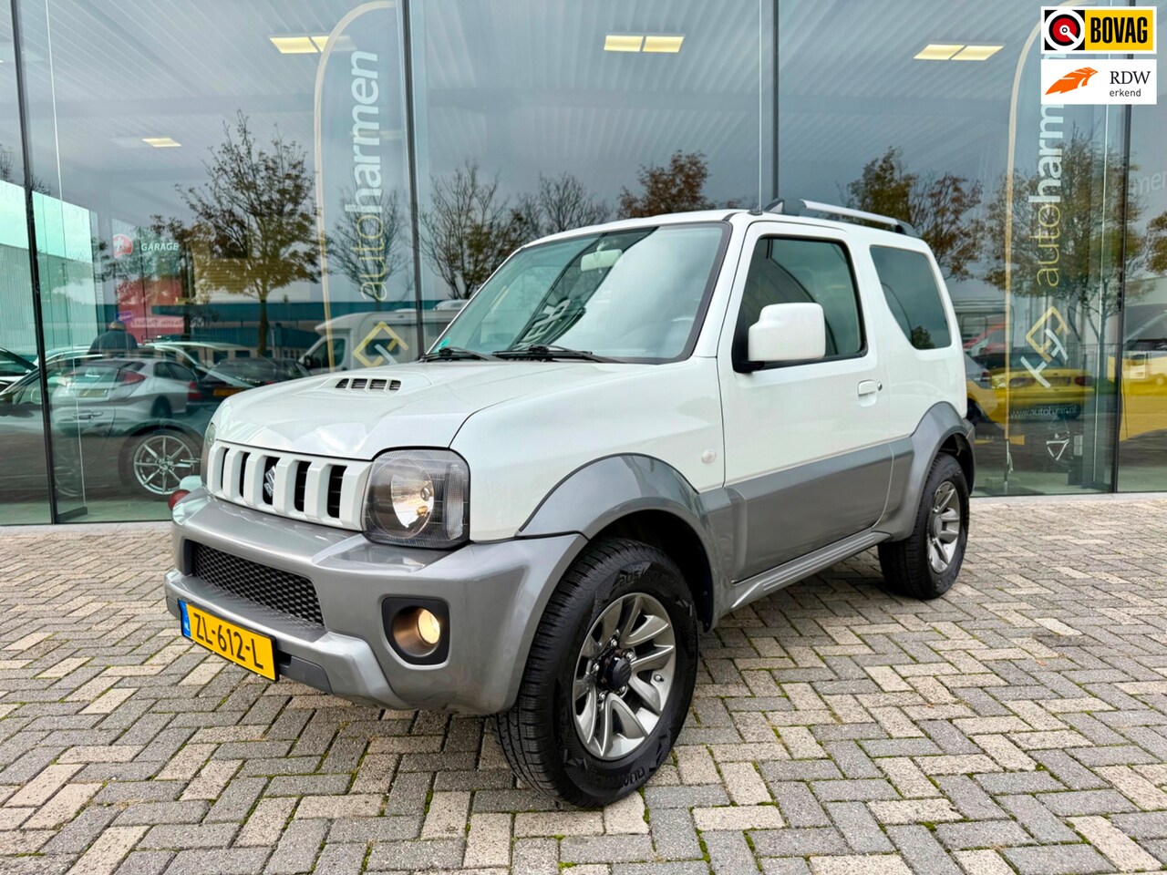 Suzuki Jimny - 1.3 Exclusive 4WD, Airco, Leer, Trekhaak - AutoWereld.nl