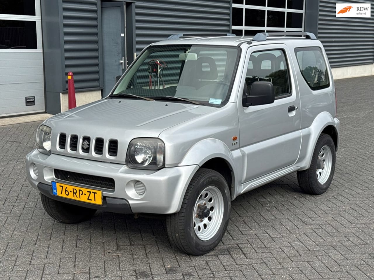 Suzuki Jimny - 1.3 JLX 4x4 - AutoWereld.nl