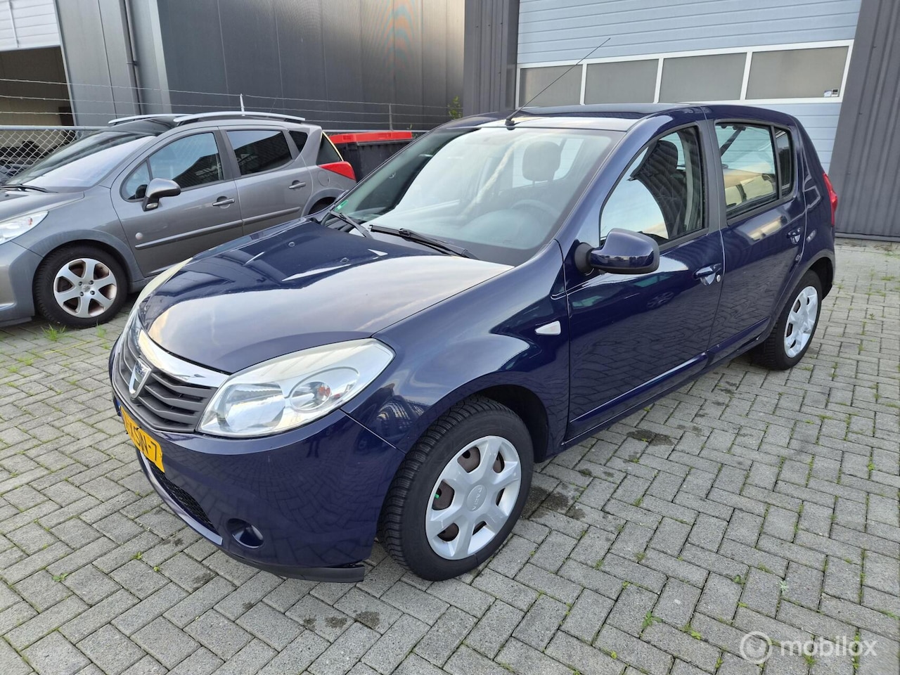 Dacia Sandero - 1.2 Lauréate LPG G3 AIRCO/APK 09/2027 - AutoWereld.nl