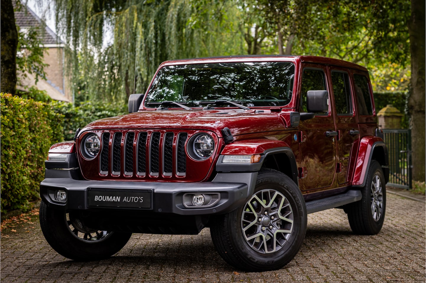 Jeep Wrangler Unlimited - 4xe 380 80th Anniversary Sky One Softtop - AutoWereld.nl