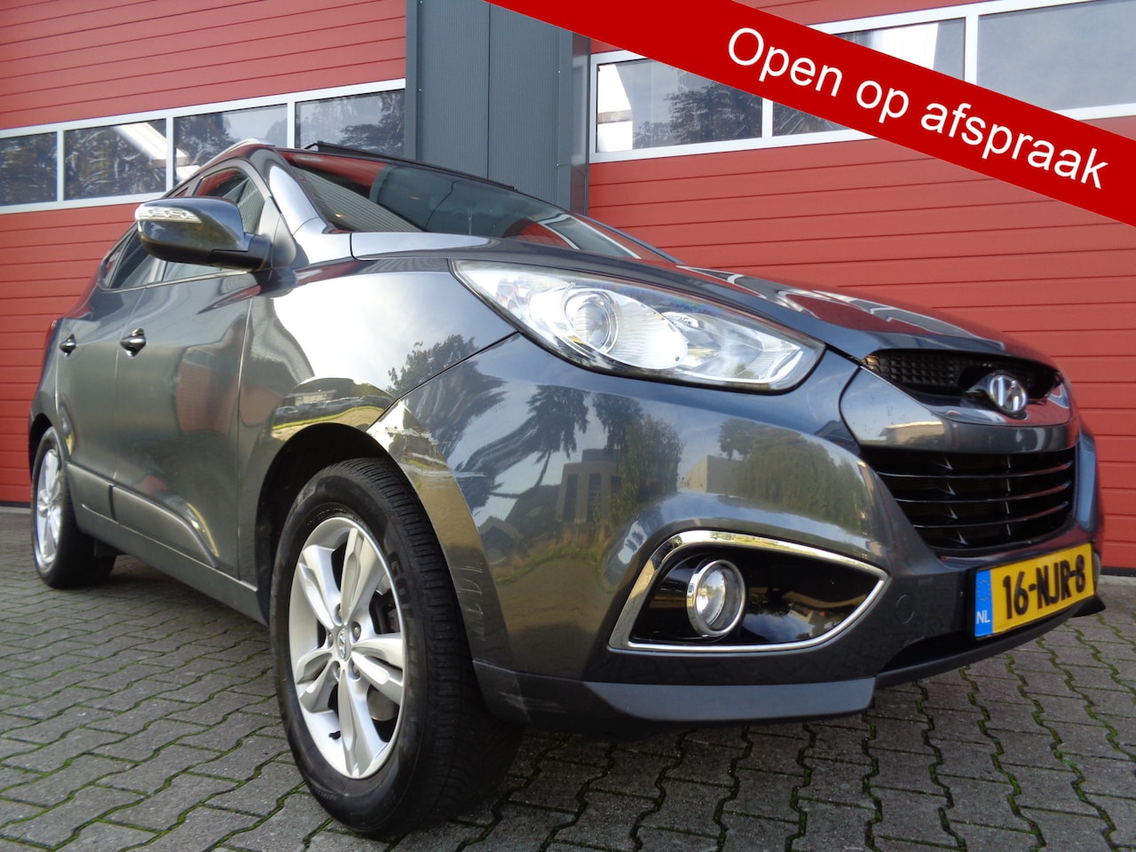 Hyundai ix35 - 2.0i i-Catcher 164PK Automaat Clima Cruise LMV Navi Trekhaak Leer NL-Auto Open-Dakje - AutoWereld.nl