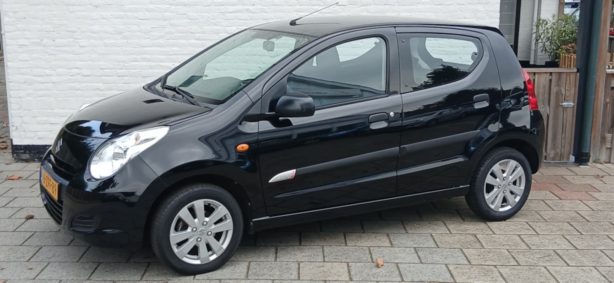 Suzuki Alto - 1.0 68pk Celebration airco licht metalen velgen - AutoWereld.nl
