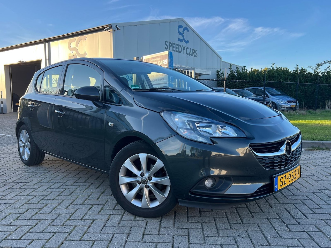 Opel Corsa - 1.4 120 Jaar Edition LPG G3 5DRS Cruise Navi PDC - AutoWereld.nl
