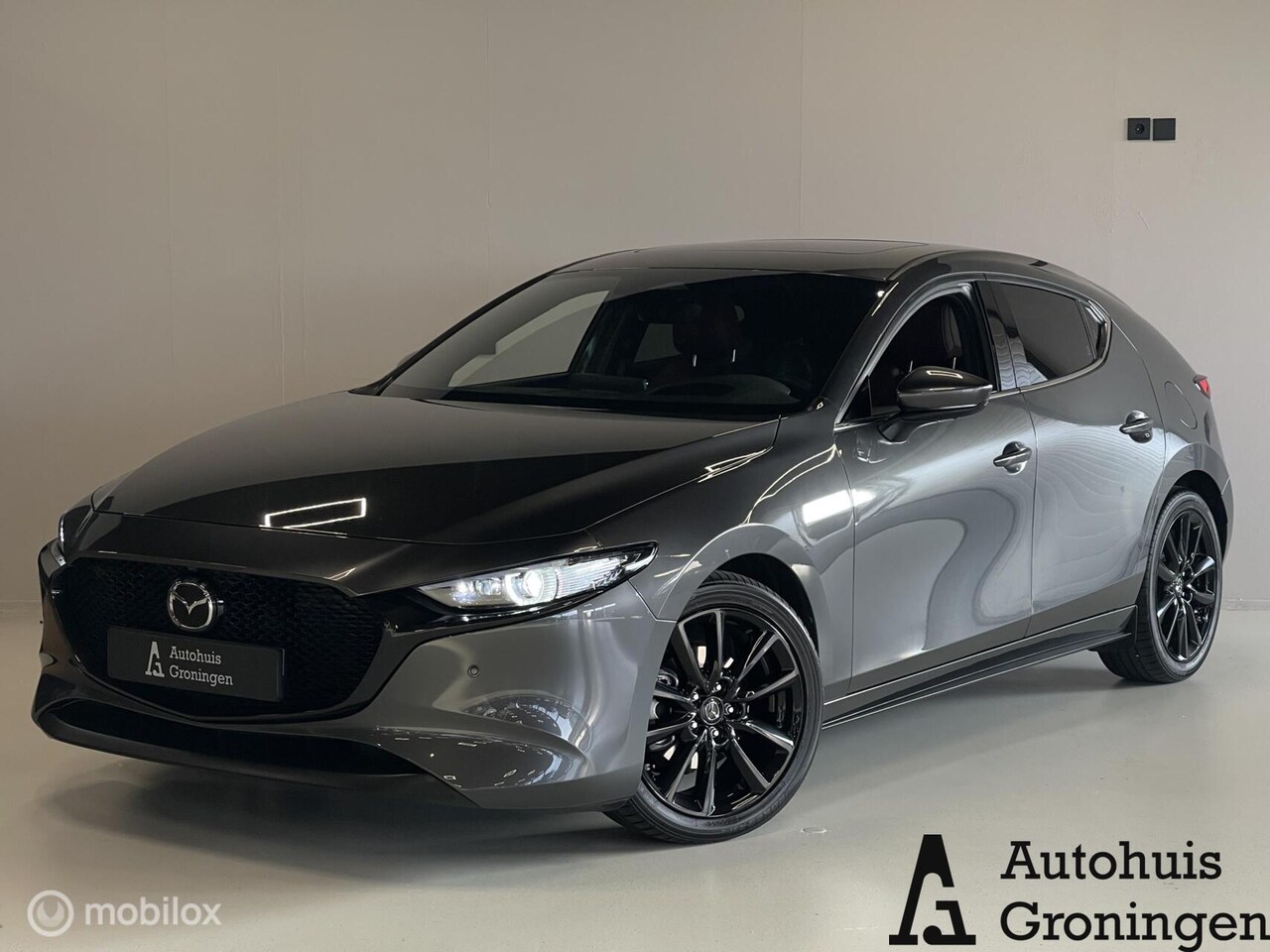 Mazda 3 - 2.0 e-Skyactiv-X M Hybrid 186 Exclusive-Line | Rood Leder | Pano | HUD | Bose | Memory - AutoWereld.nl