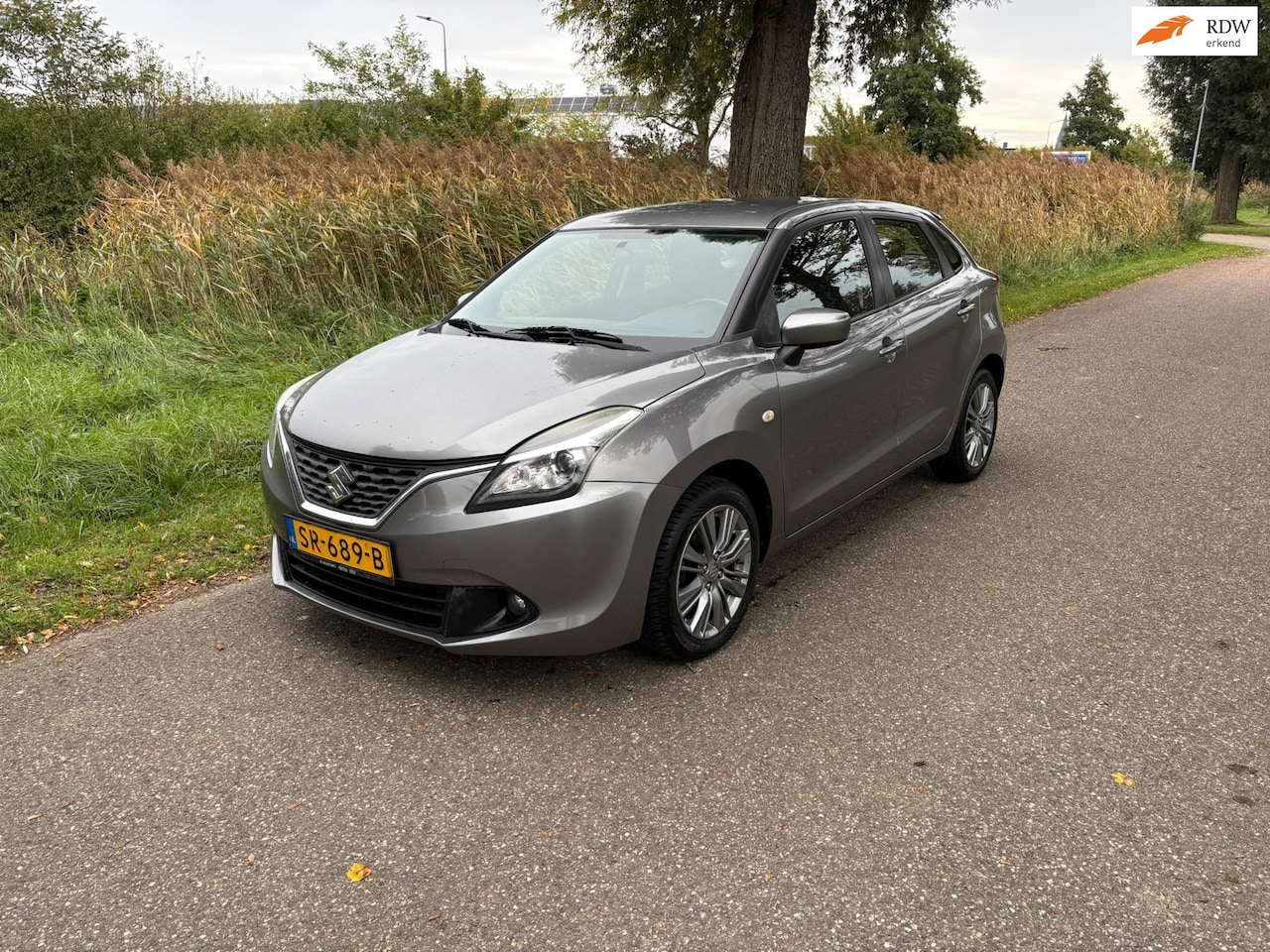 Suzuki Baleno - 1.2 Exclusive Airco Stoelverwarming Bluetooth Lm Velgen Mist Lampen Voor Elk Ramen - AutoWereld.nl