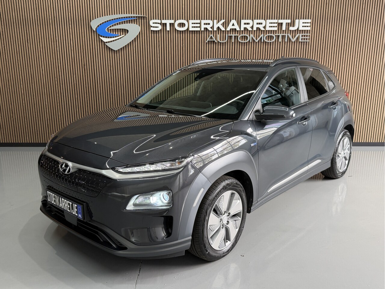 Hyundai Kona Electric - EV 64 kWh SOH 100% NavI | Warmtepomp | Stoel & Stuur verwarming | 17" | ACC | 100 % elk ja - AutoWereld.nl