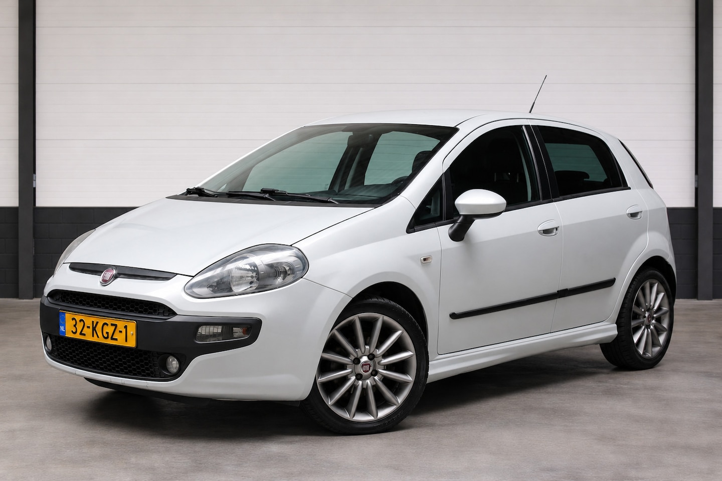 Fiat Punto Evo - 1.4 Racing Airco Navigatie LMV - AutoWereld.nl