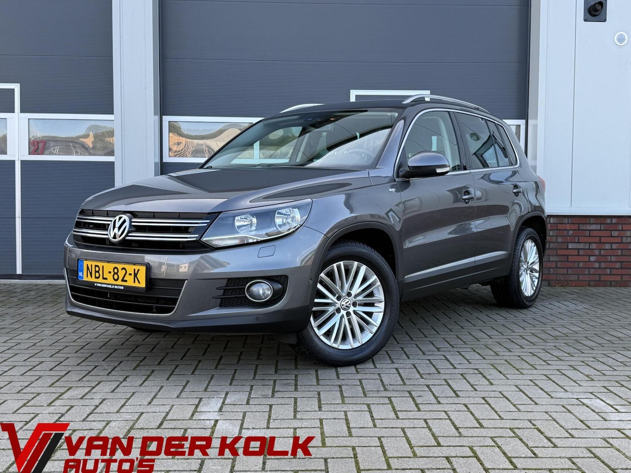 Volkswagen Tiguan - 1.4 TSI CUP | Navigatie | Cruise | Climate | Stoelverwarming | Sensoren - AutoWereld.nl