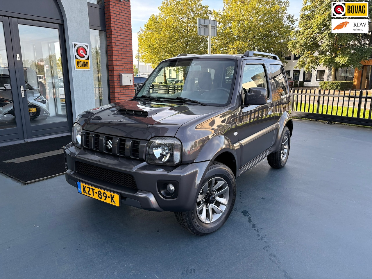 Suzuki Jimny - 1.3 Exclusive LEDER STOELVERWARMING AIRCO LMV - AutoWereld.nl