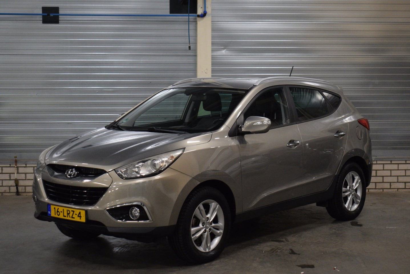 Hyundai ix35 - 2.0i Style 116.000KM + Navigatie|Achteruitrijcamera|Bluetooth|Trekhaak| - AutoWereld.nl