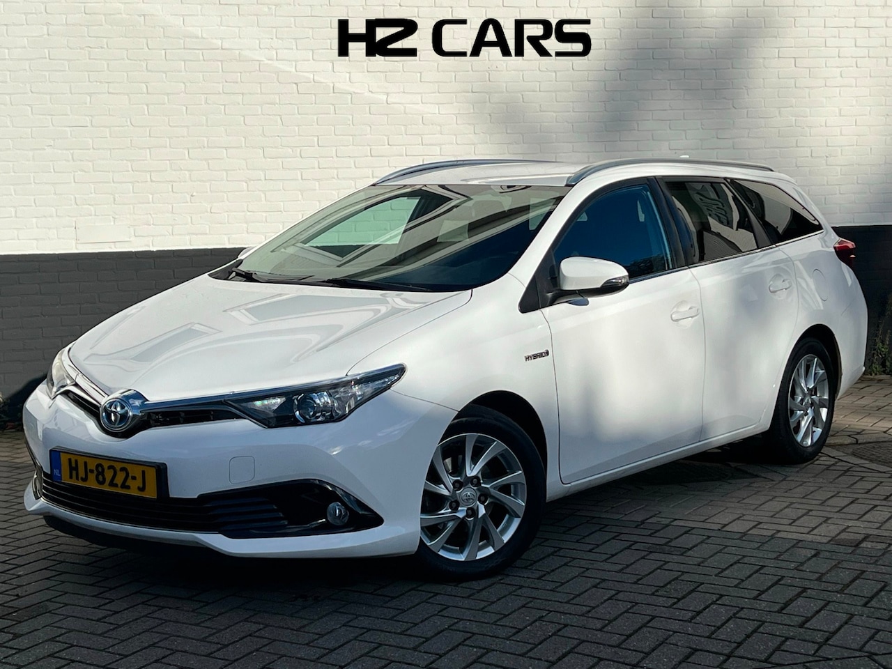 Toyota Auris Touring Sports - 1.8 Hybrid Lease|Trekhaak|Camera|Navi|Clima - AutoWereld.nl