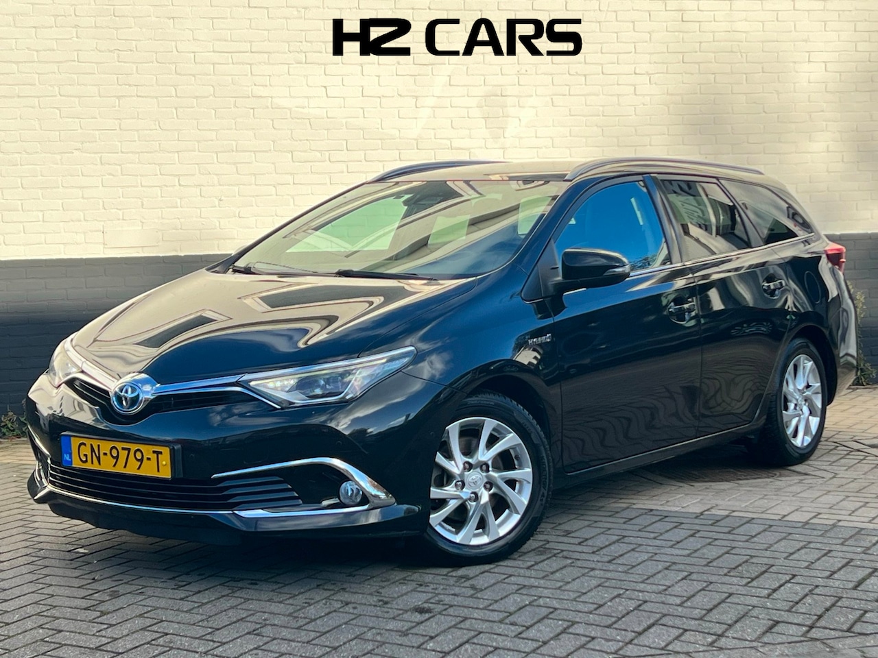 Toyota Auris Touring Sports - 1.8 Hybrid Lease Pro|Pano|Leder|Parkpilot|Camera|Navi|Clima|Cruise - AutoWereld.nl