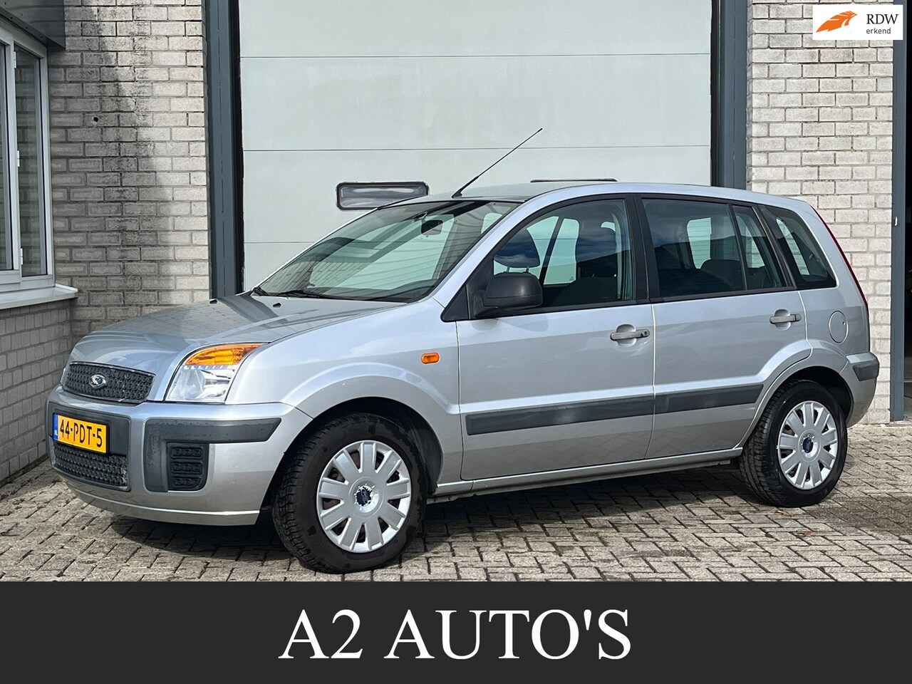 Ford Fusion - 1.4-16V Cool & Sound Airco|Nap|Trekhaak - AutoWereld.nl